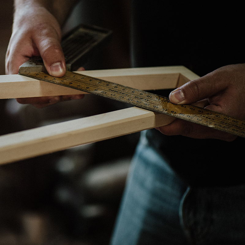 hardwood-flooring-measuring Hardwood Flooring in Victoria installation with hands measuring wood